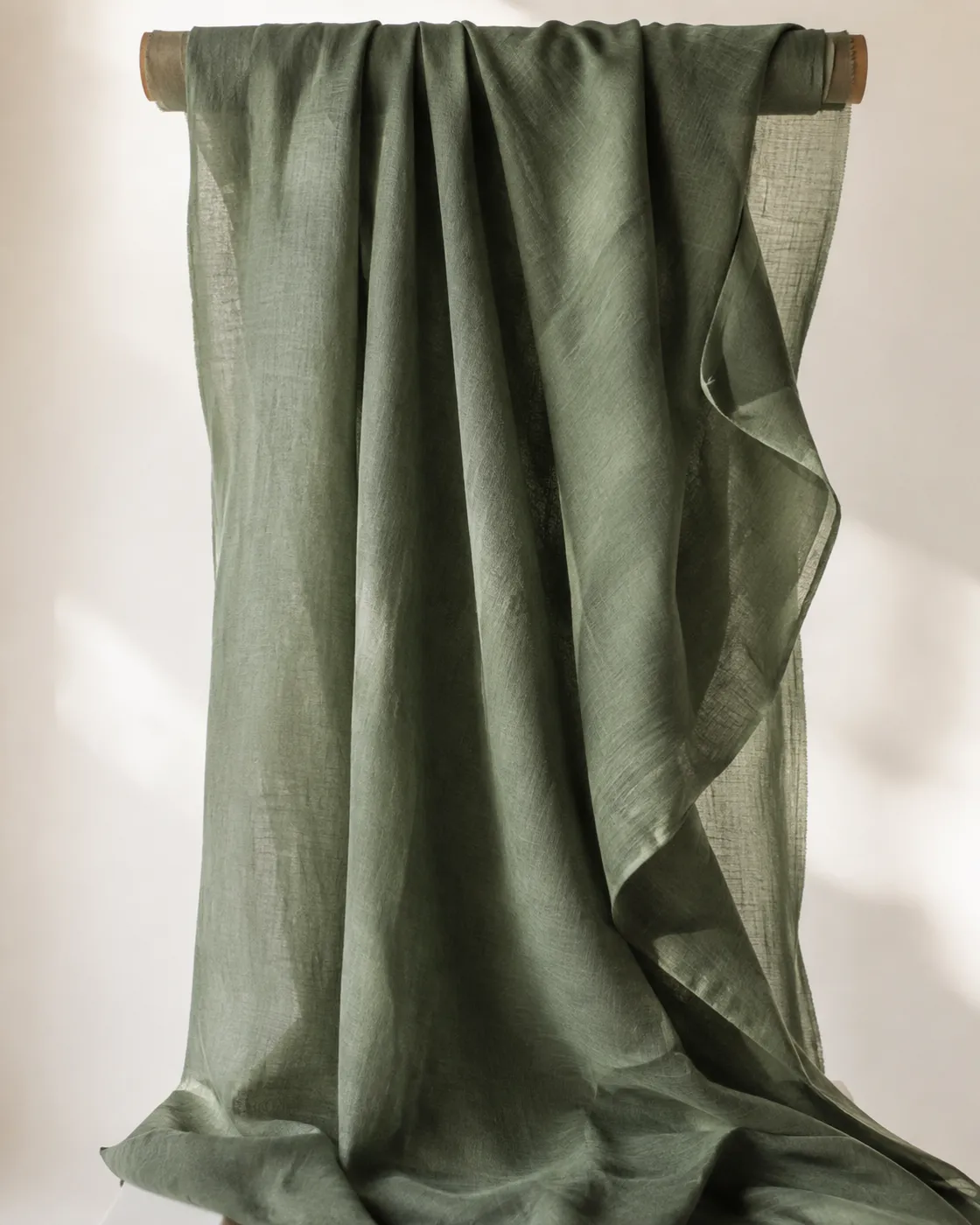 A soft green cloth, draped